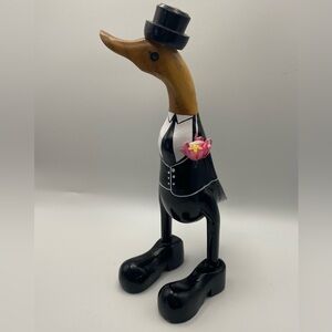 Carved wooden duck in a tux